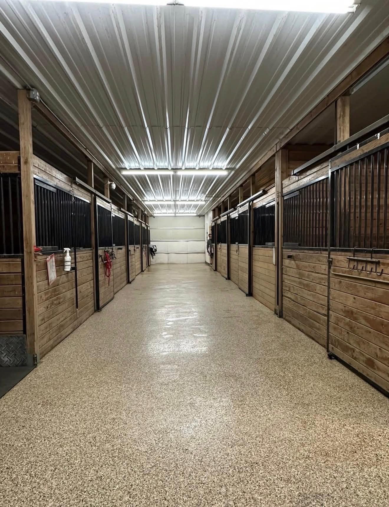 Clean barn aisle with stalls